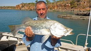 Happy Angler with Barramundi caught on Peter Tuckers Sportfishing Tour